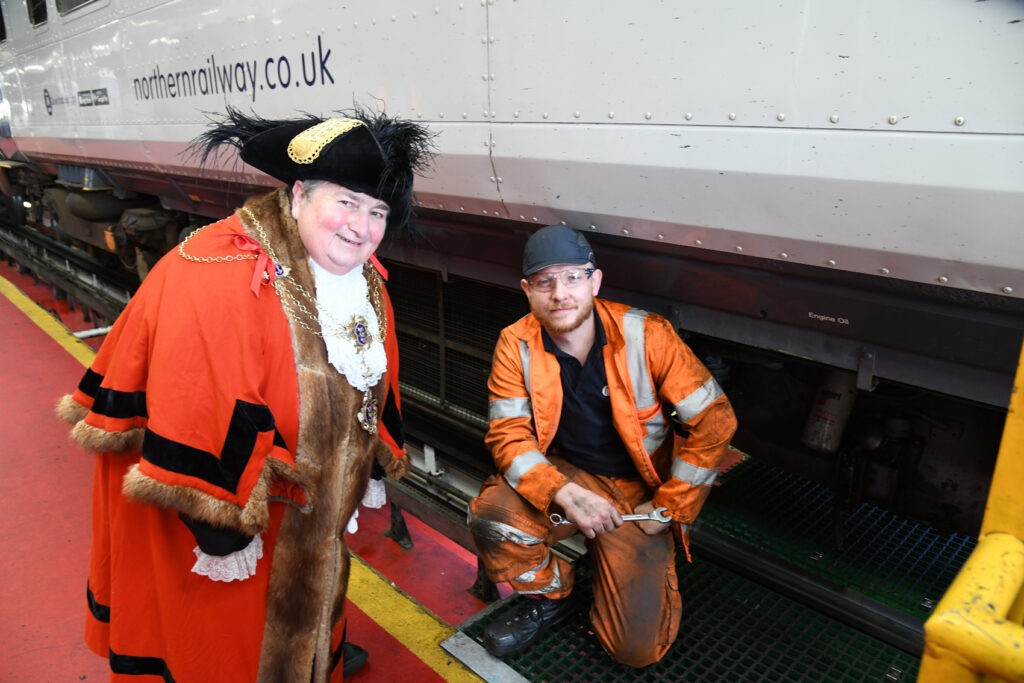 KEEPING TRAINS ON TRACK: Councillor Payne meeting engineers at Northern’s Botanic Gardens TrainCare Centre