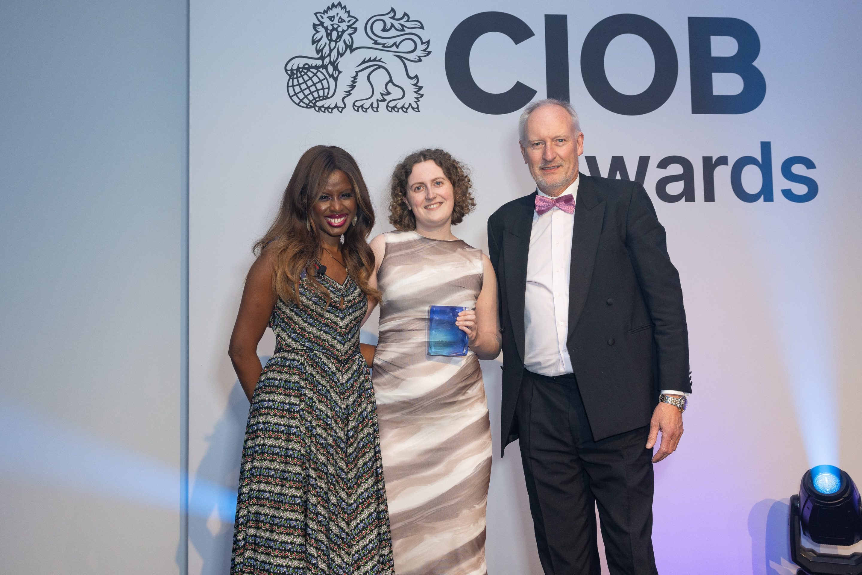 Katy Robinson receives her CIOB award from host June Sarpong and sponsor Mark Winslet